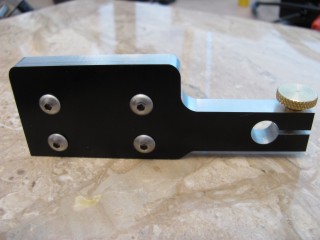 Rear view of indicator holder showing the four bolts that hold
        the dovetails on