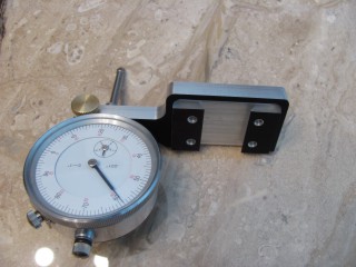 Dial indicator holder with dial indicator clamped in it